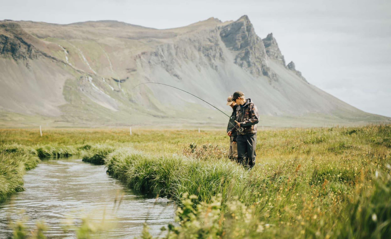 Calm waters with mountains in the distance
